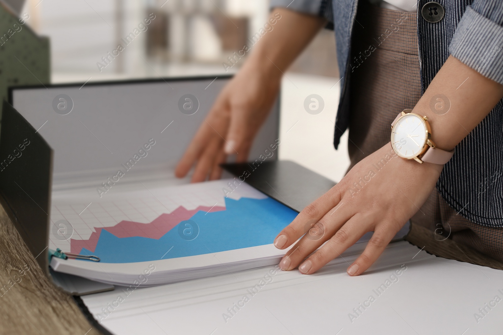 Photo of Businesswoman working with documents at office table, closeup