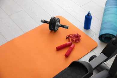 Sport equipment near elliptical machine in gym