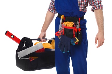 Photo of Construction worker with set of tools on white background, closeup