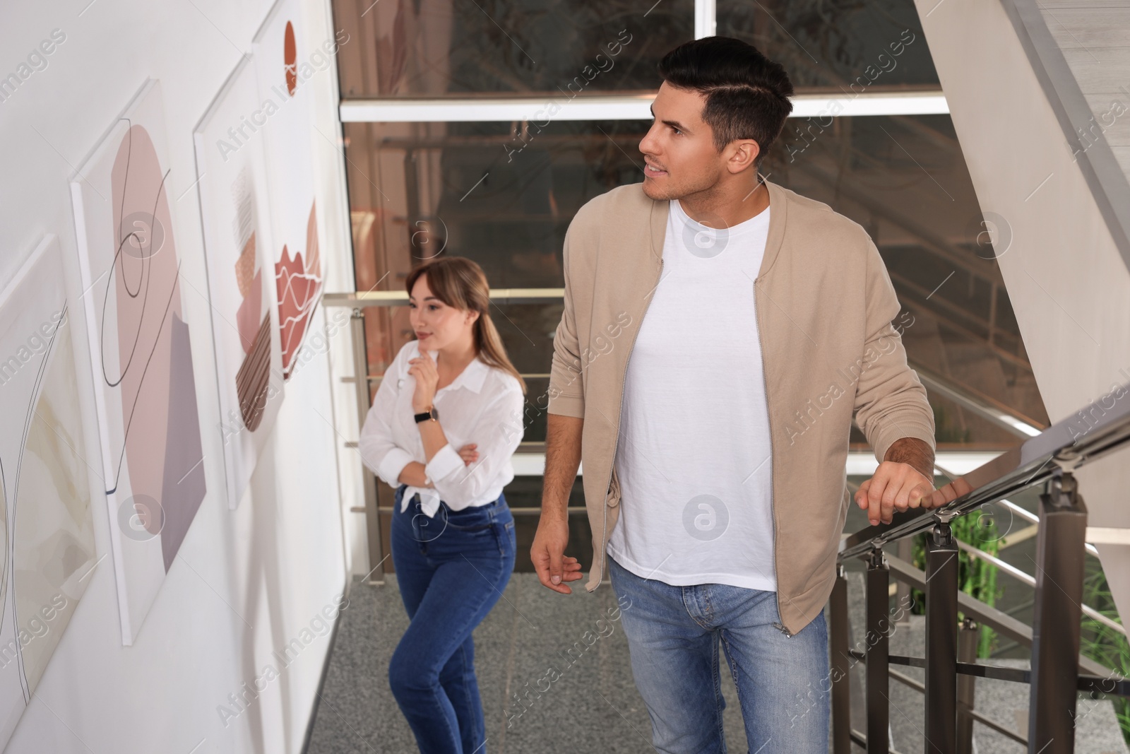 Photo of Happy man at exhibition in art gallery