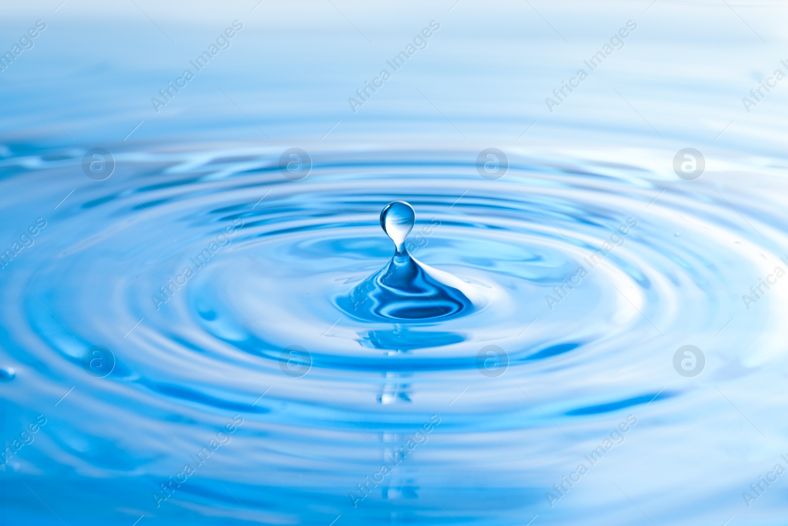 Photo of Splash of clear water with drop as background, closeup