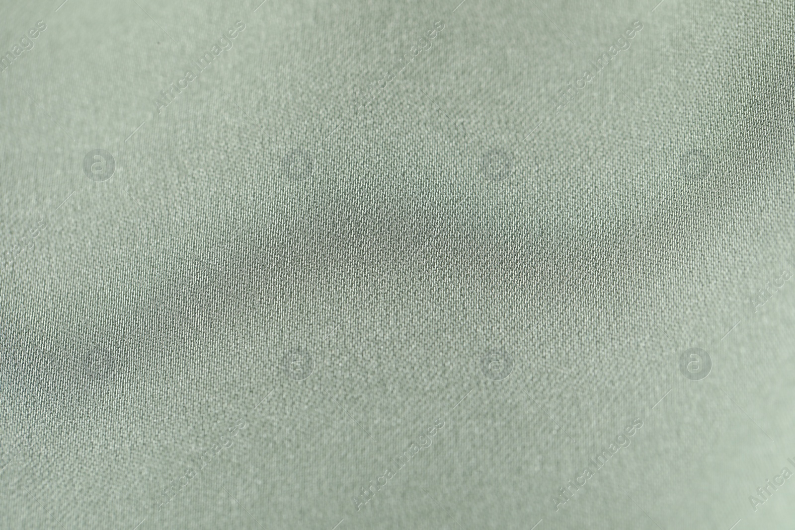 Photo of Texture of light green fabric as background, top view