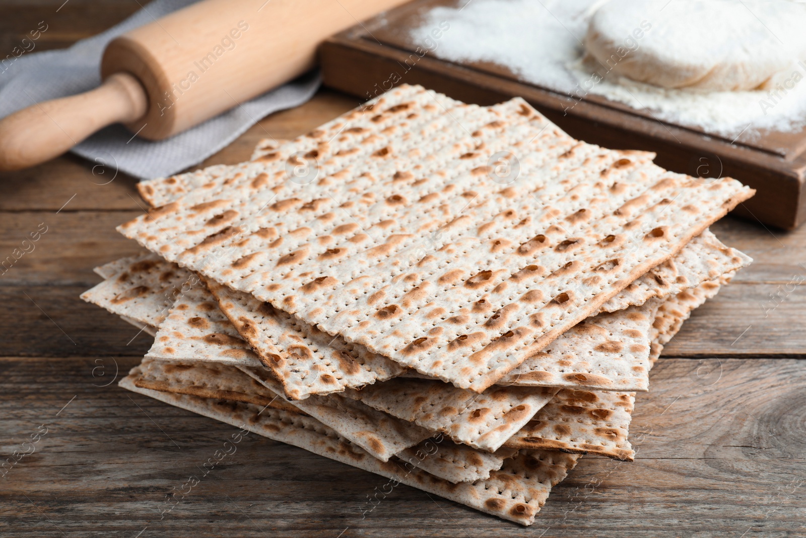 Photo of Stack of traditional matzos on wooden table