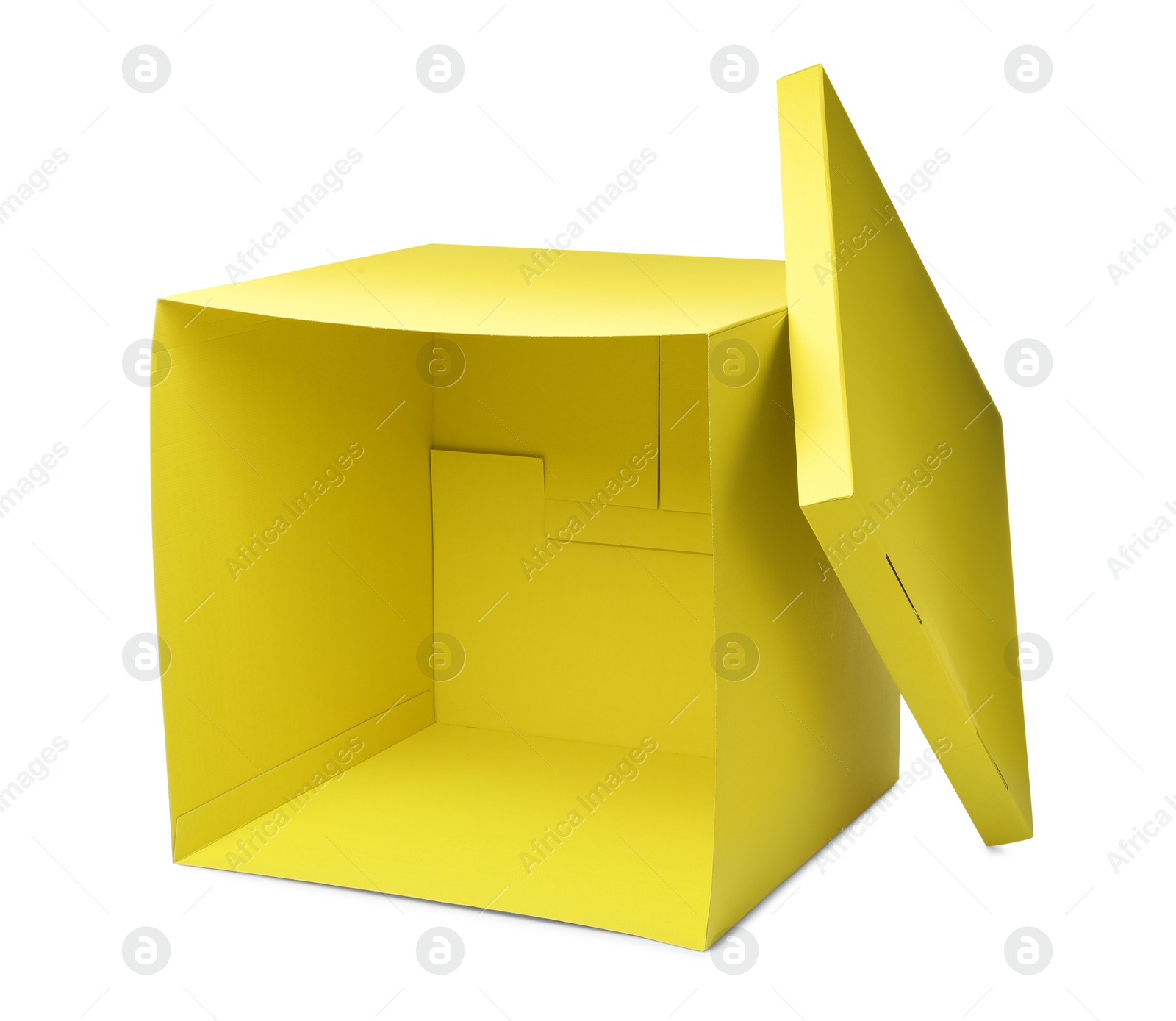 Photo of Yellow gift box with cap isolated on white