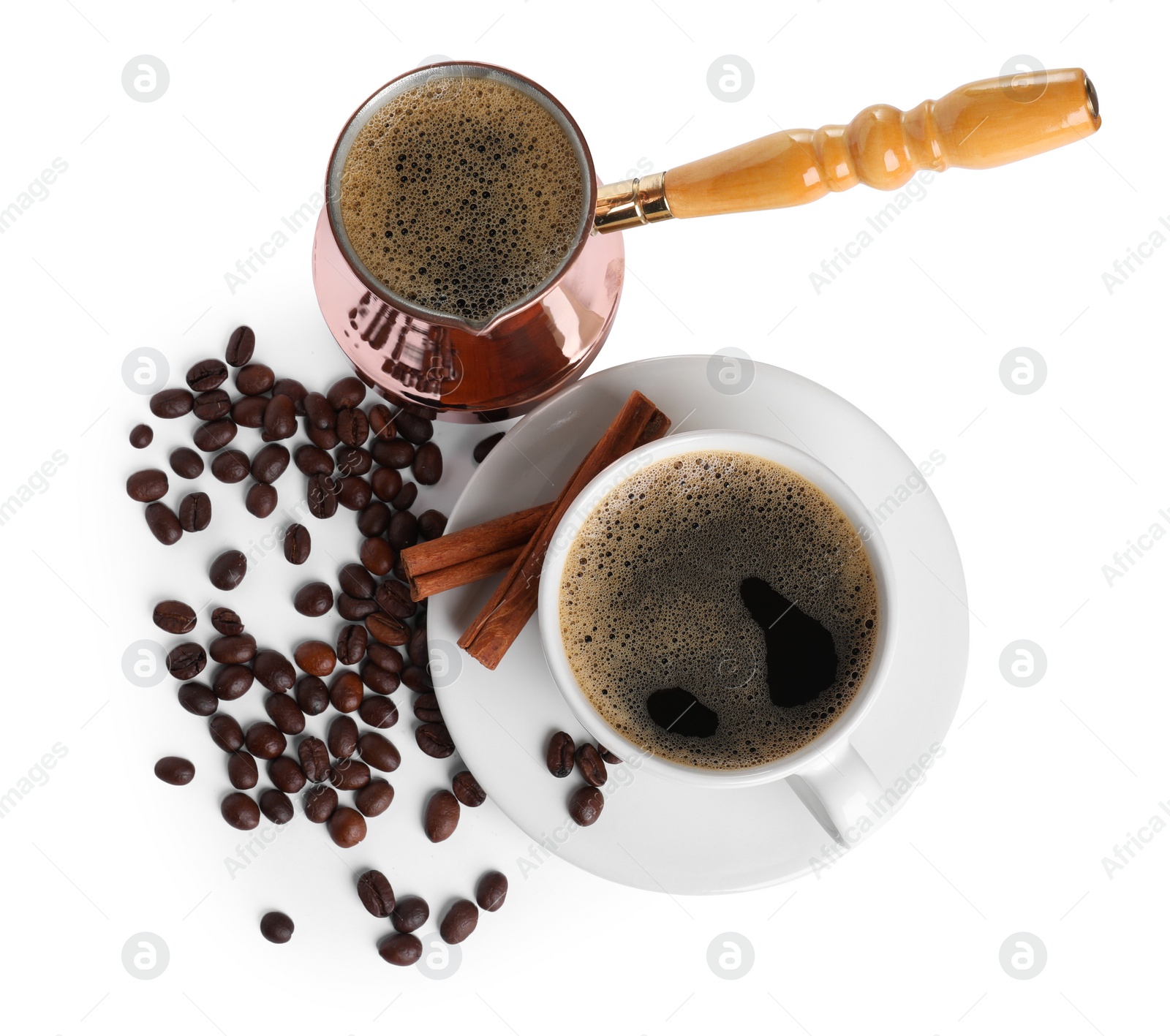 Photo of Turkish coffee. Cezve and cup with hot coffee, beans and cinnamon on white background, top view