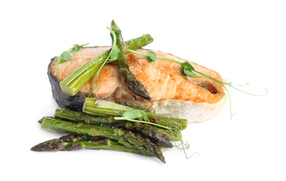 Photo of Tasty salmon steak with asparagus isolated on white