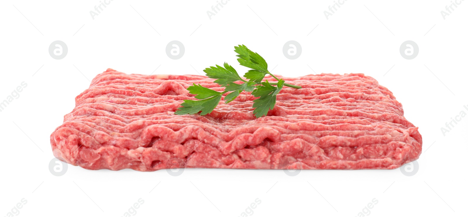 Photo of Raw ground meat and parsley isolated on white