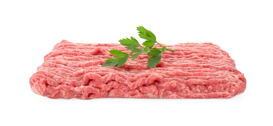 Photo of Raw ground meat and parsley isolated on white