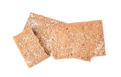 Photo of Fresh broken rye crispbreads isolated on white, top view