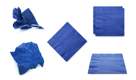 Image of Set with blue paper napkins on white background
