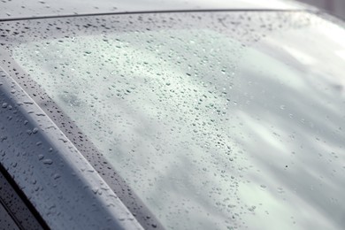 Photo of Rain drops on car windshield, closeup view