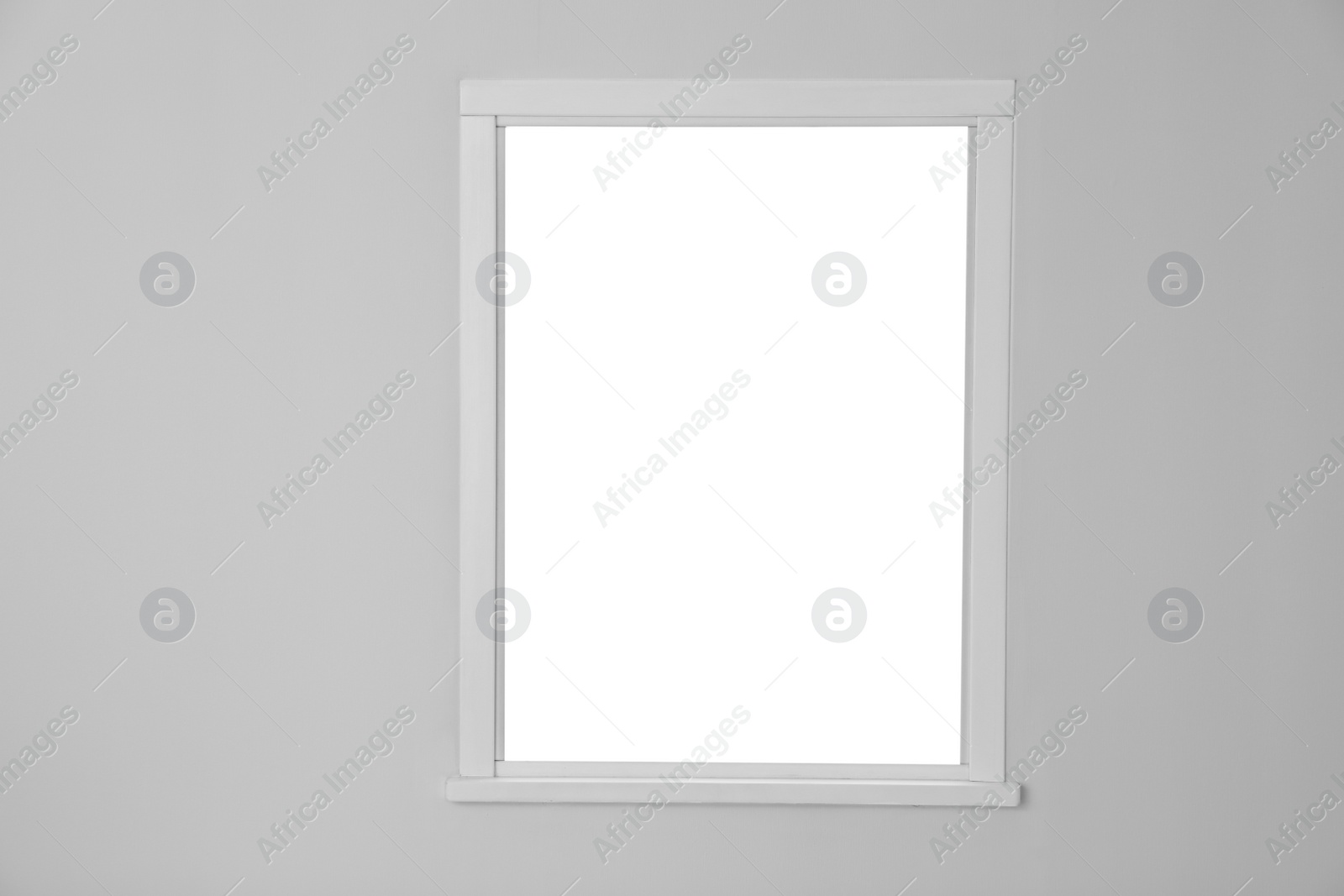 Photo of White wall with modern window indoors. Element of interior