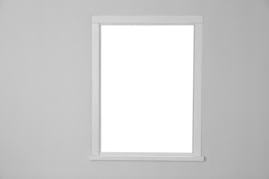 Photo of White wall with modern window indoors. Element of interior