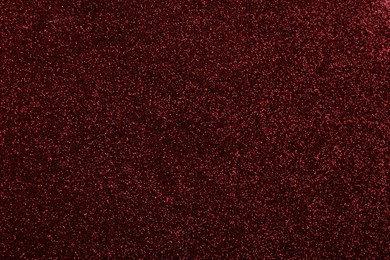 Beautiful shiny burgundy glitter as background, closeup