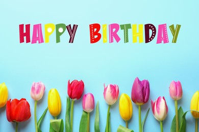 Image of Happy Birthday! Beautiful tulips on light blue background, flat lay