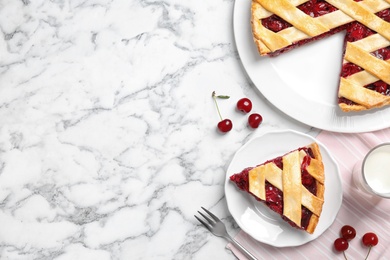 Photo of Delicious fresh cherry pie served on white marble table, flat lay. Space for text