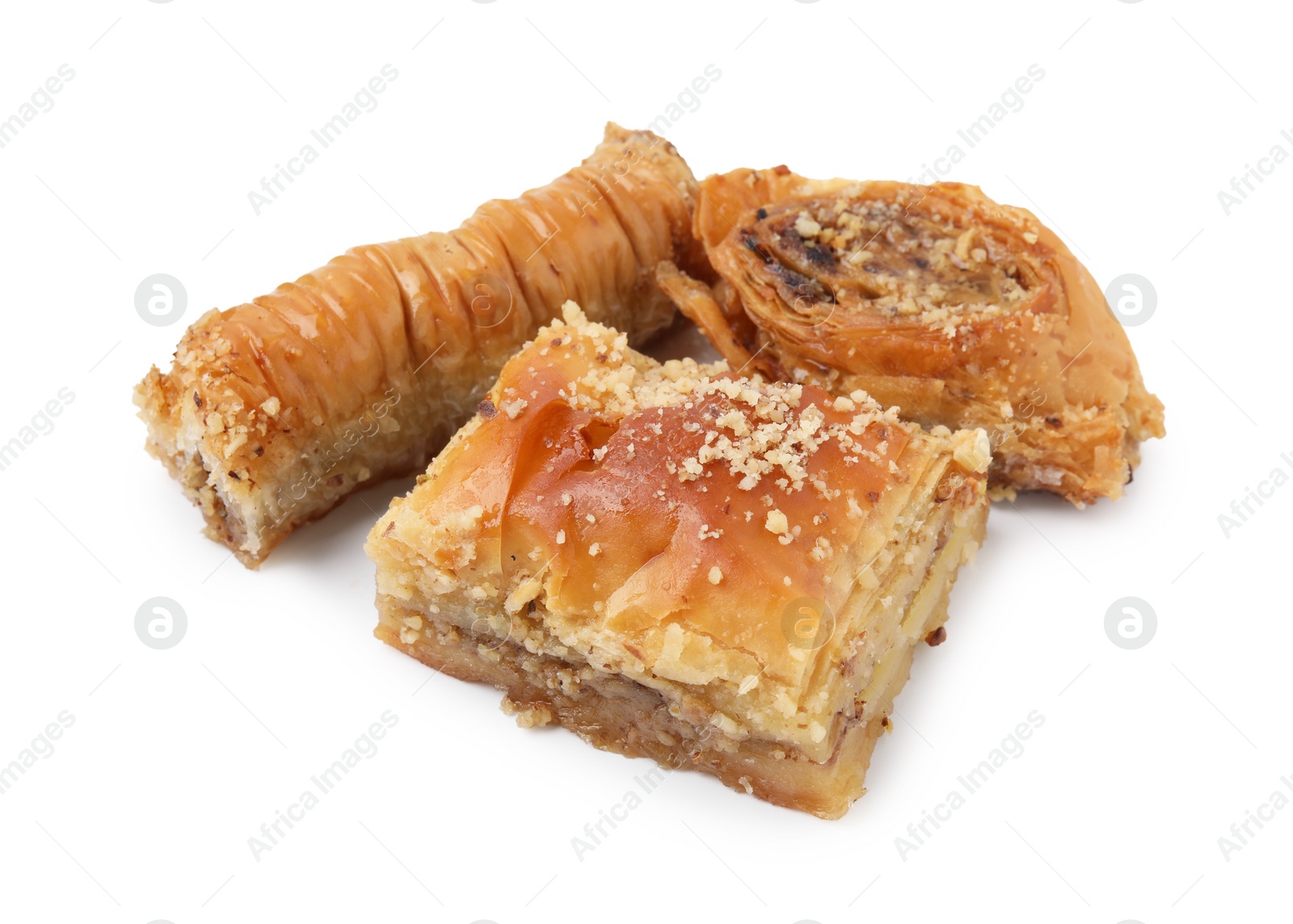 Photo of Eastern sweets. Pieces of tasty baklava isolated on white