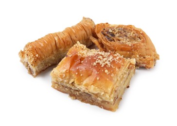 Photo of Eastern sweets. Pieces of tasty baklava isolated on white