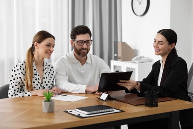 Couple having meeting with lawyer in office