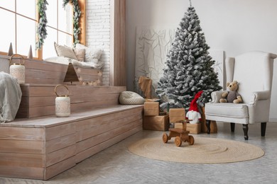Photo of Stylish room interior with Christmas tree and festive decor