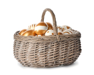 Photo of Wicker basket with traditional Easter eggs on white background