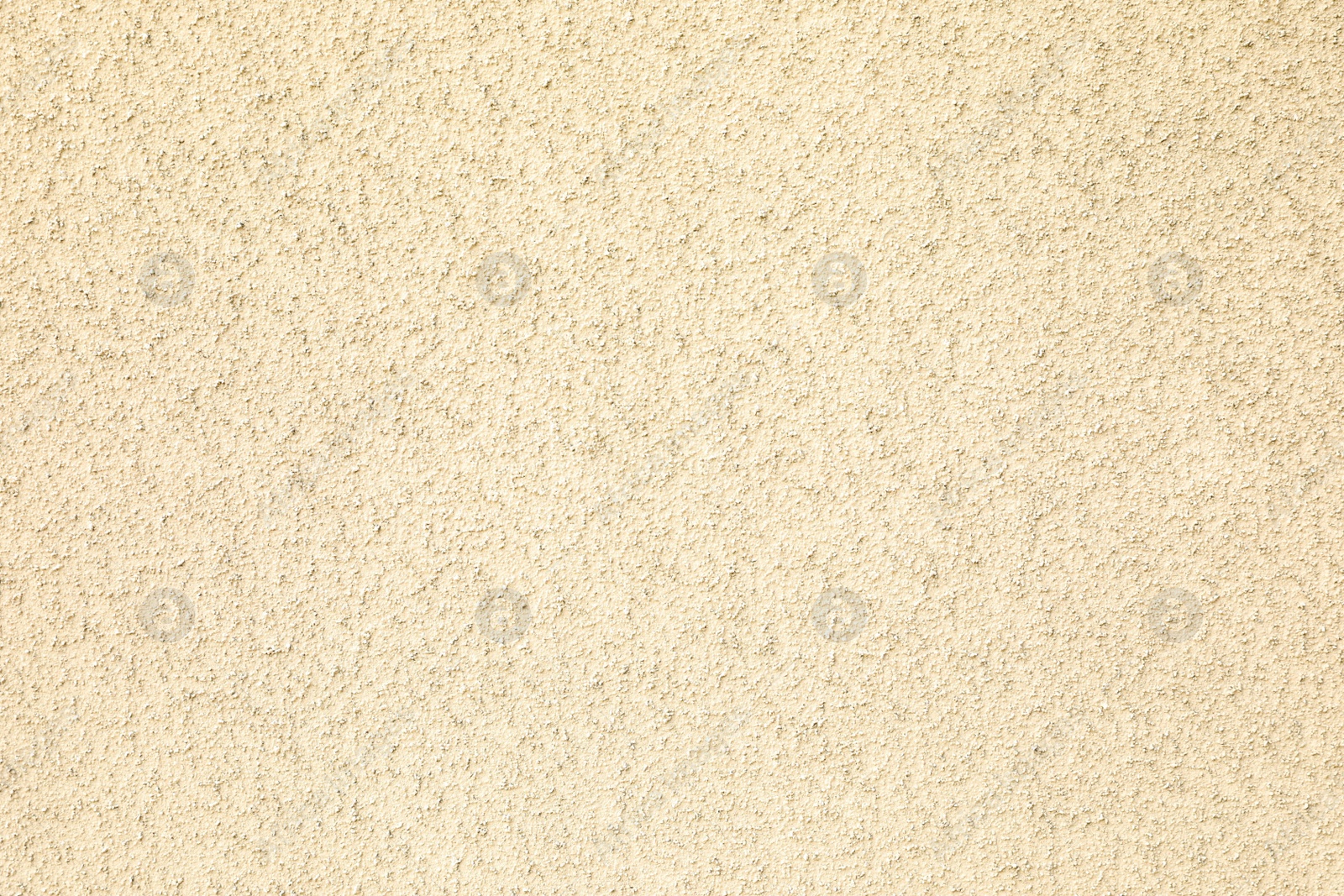 Photo of Texture of beige plaster wall as background