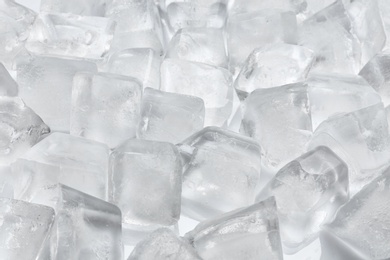 Photo of Pile of ice cubes on white background