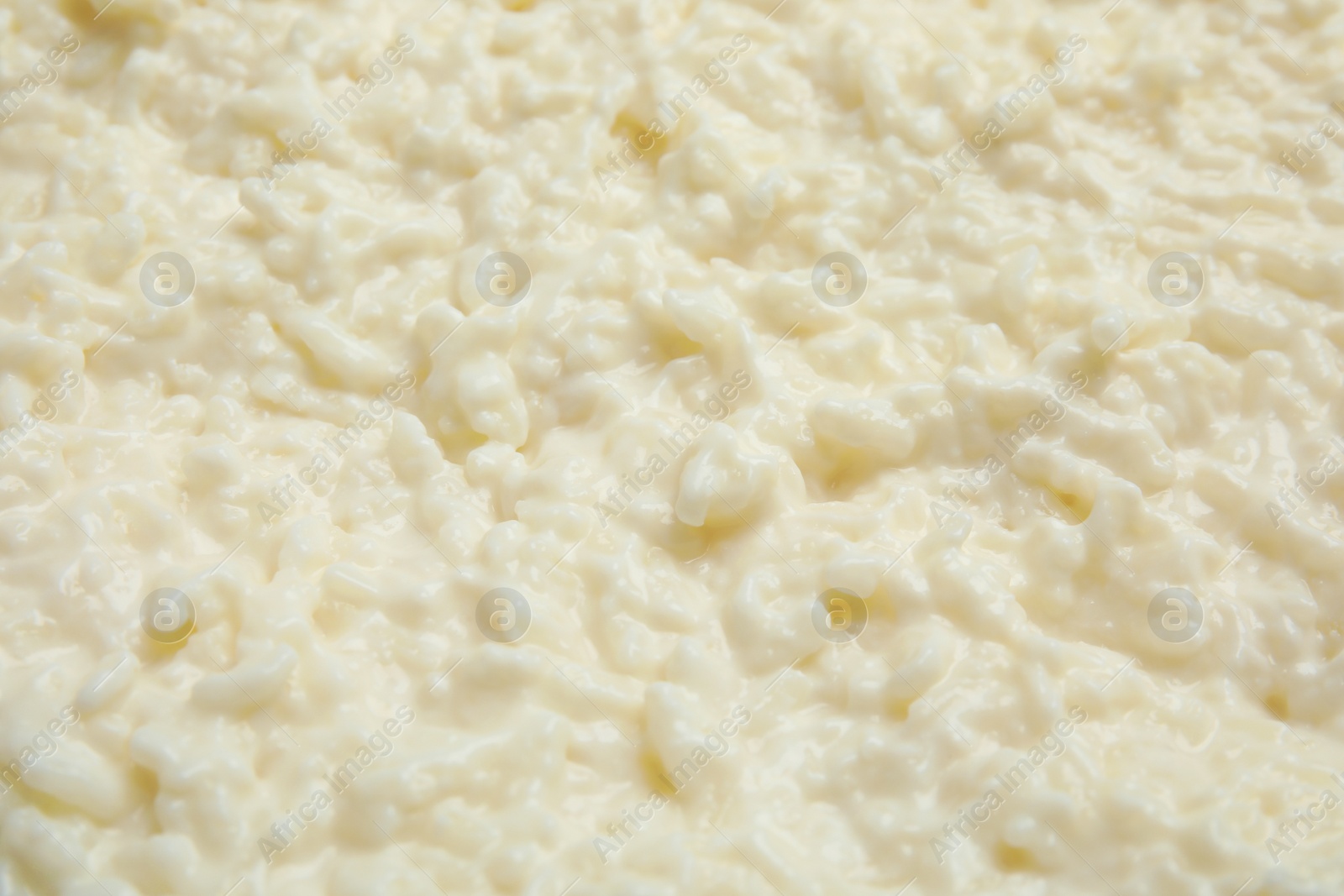Photo of Delicious creamy rice pudding as background, closeup