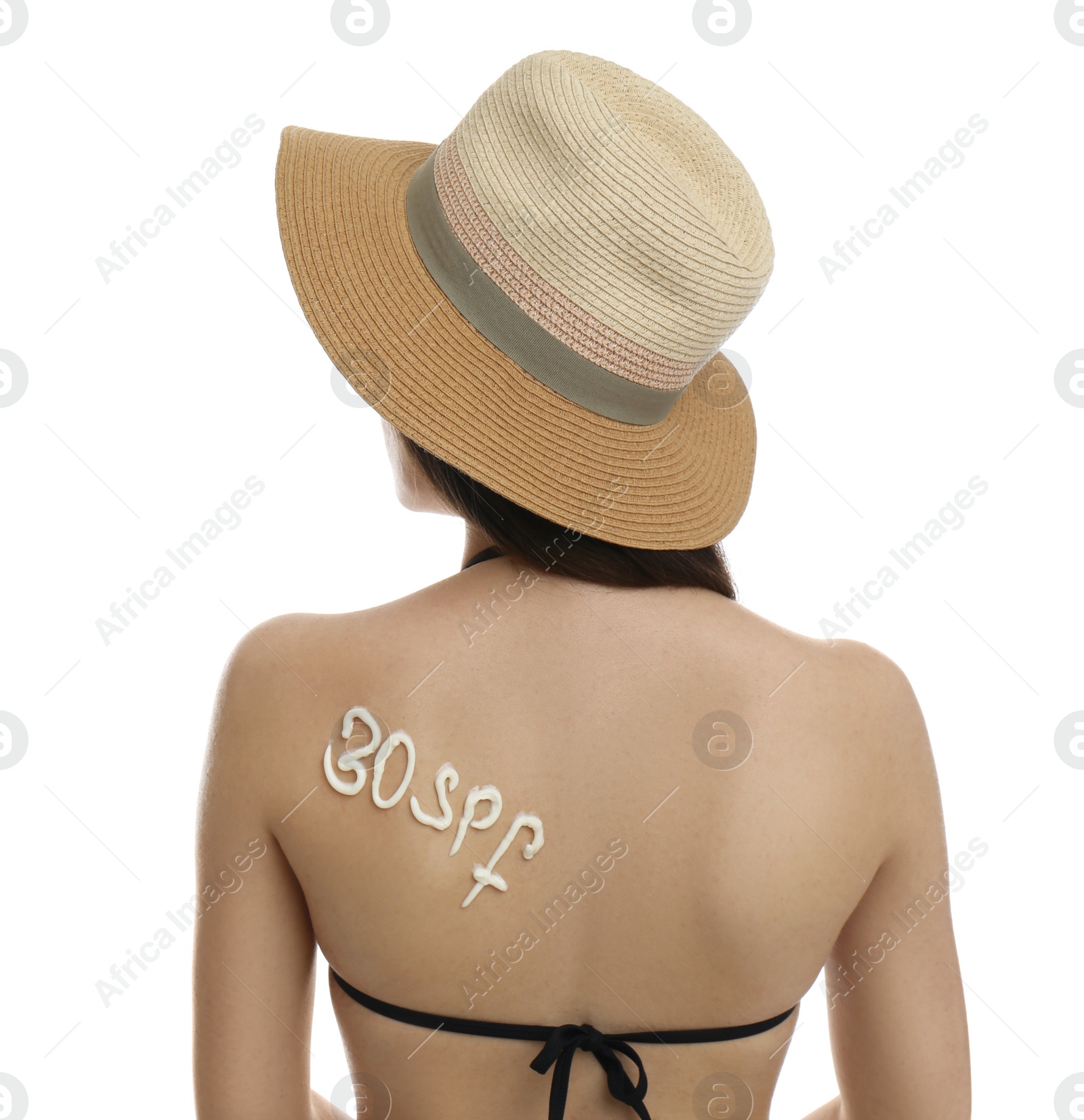 Photo of Text 30 SPF written with sun protection cream on woman's back against white background