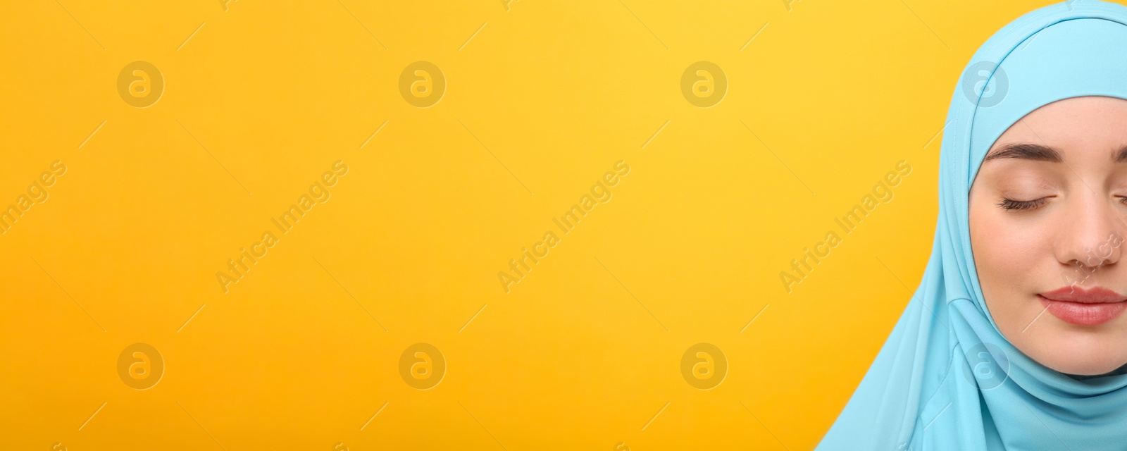 Image of Portrait of Muslim woman in hijab on yellow background, space for text. Banner design