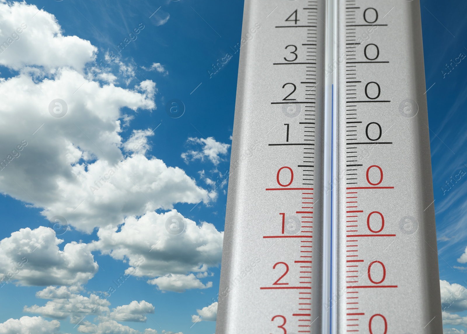 Image of Weather thermometer and beautiful sky with fluffy clouds on background