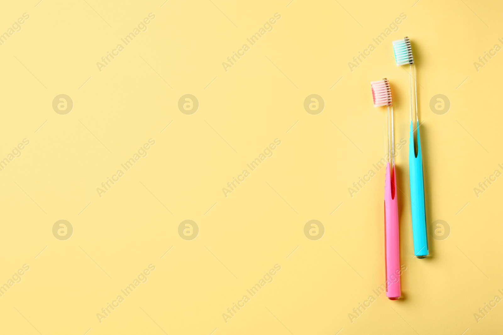 Photo of Manual toothbrushes on color background. Dental care