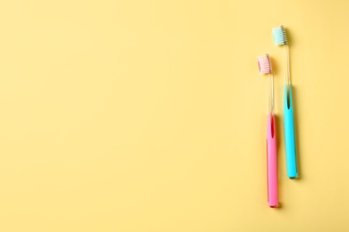 Photo of Manual toothbrushes on color background. Dental care