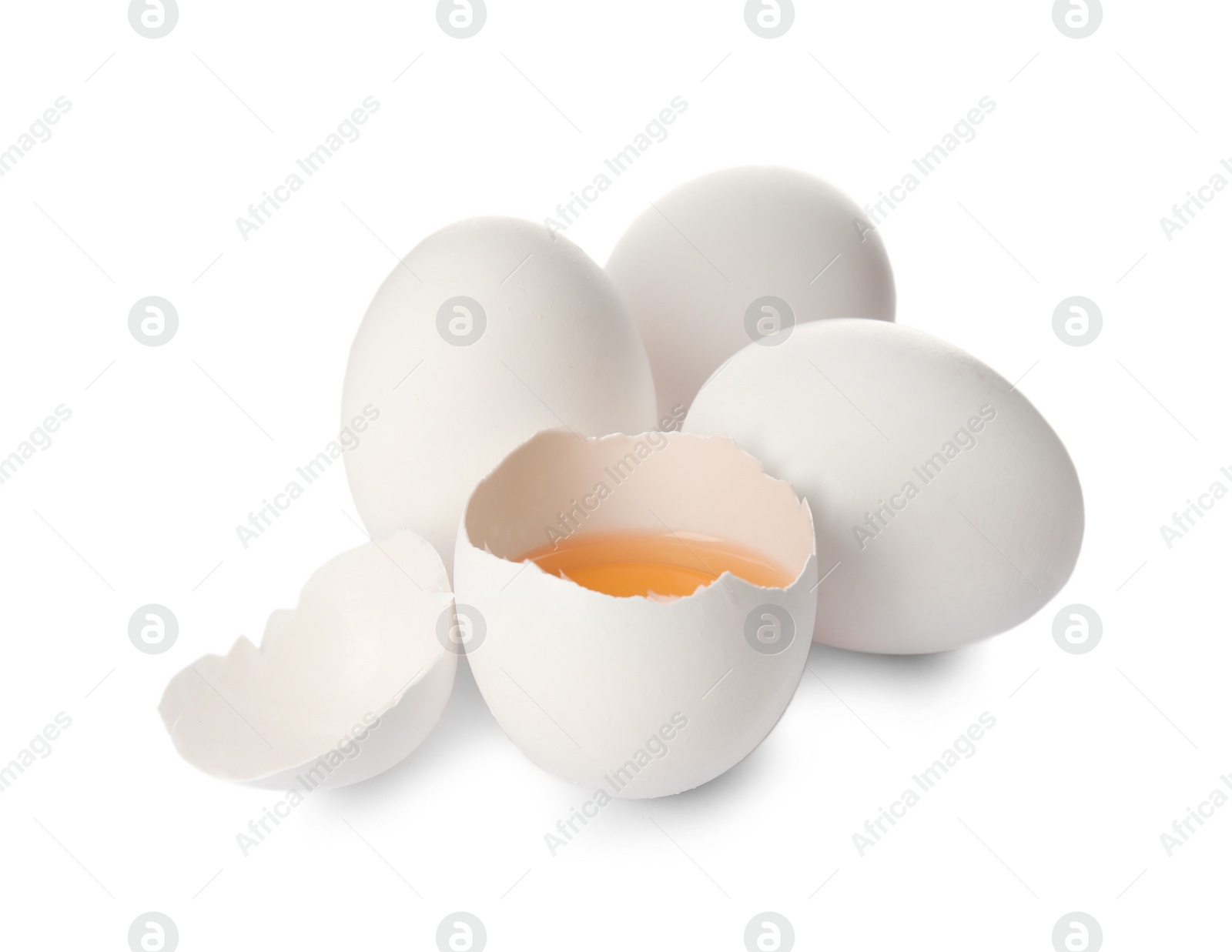 Photo of Cracked and whole chicken eggs on white background