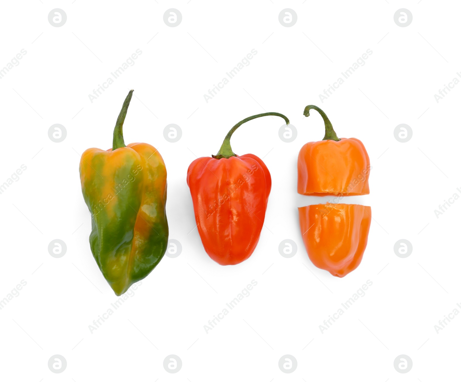 Photo of Different hot chili peppers on white background, flat lay