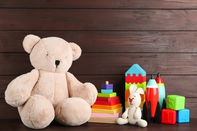 Photo of Set of different toys on wooden table