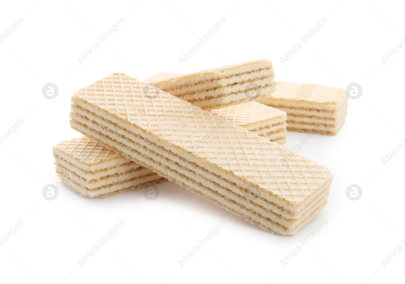 Photo of Delicious vanilla wafer sticks isolated on white