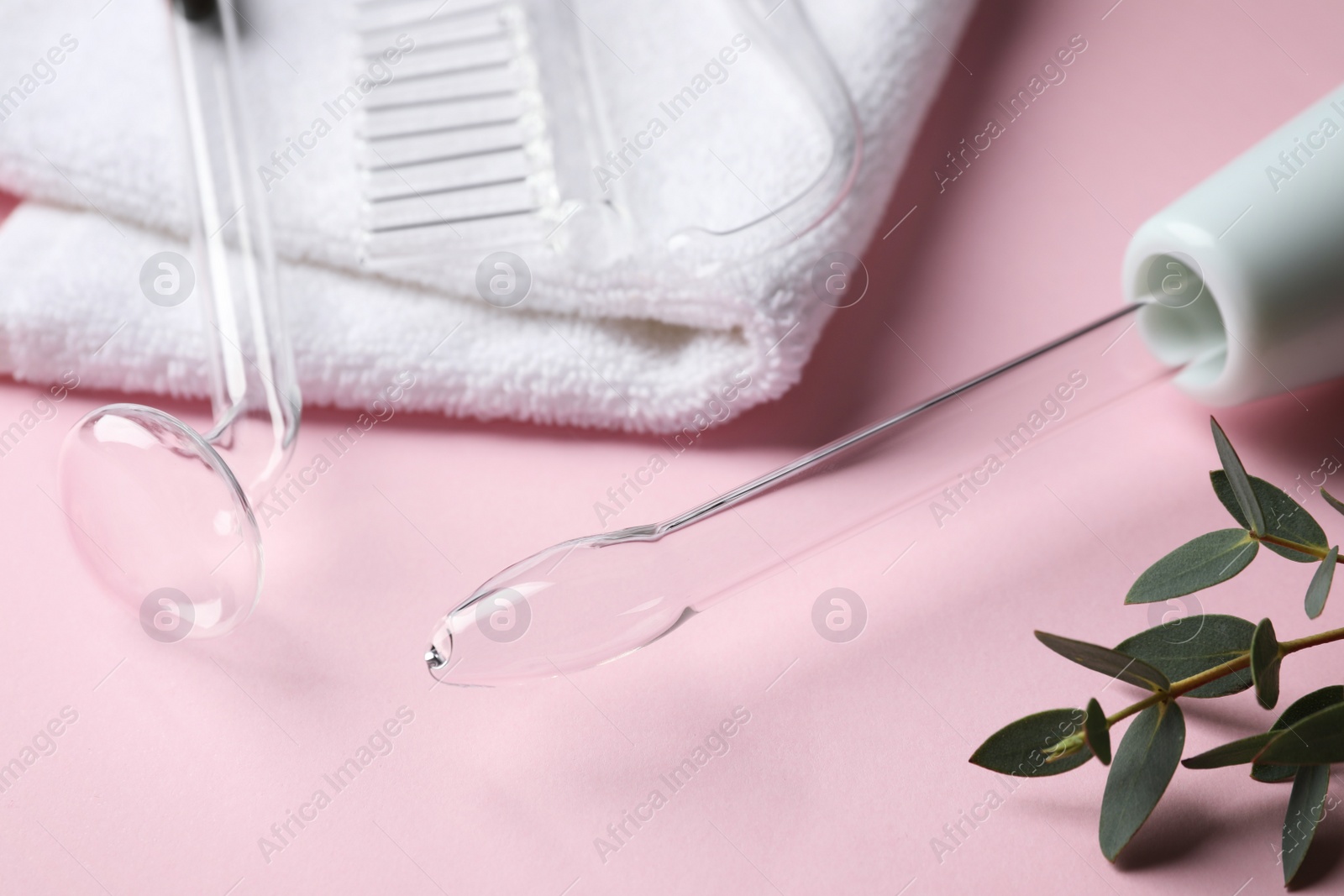 Photo of Darsonval with different nozzles on pink background, closeup