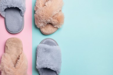 Photo of Different soft slippers on color background, flat lay. Space for text