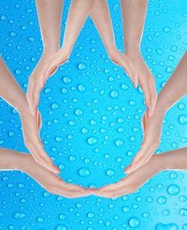 Image of Men forming water drop with their hands on blue background. Ecology protection