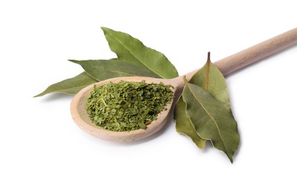 Whole and ground aromatic bay leaves on white background