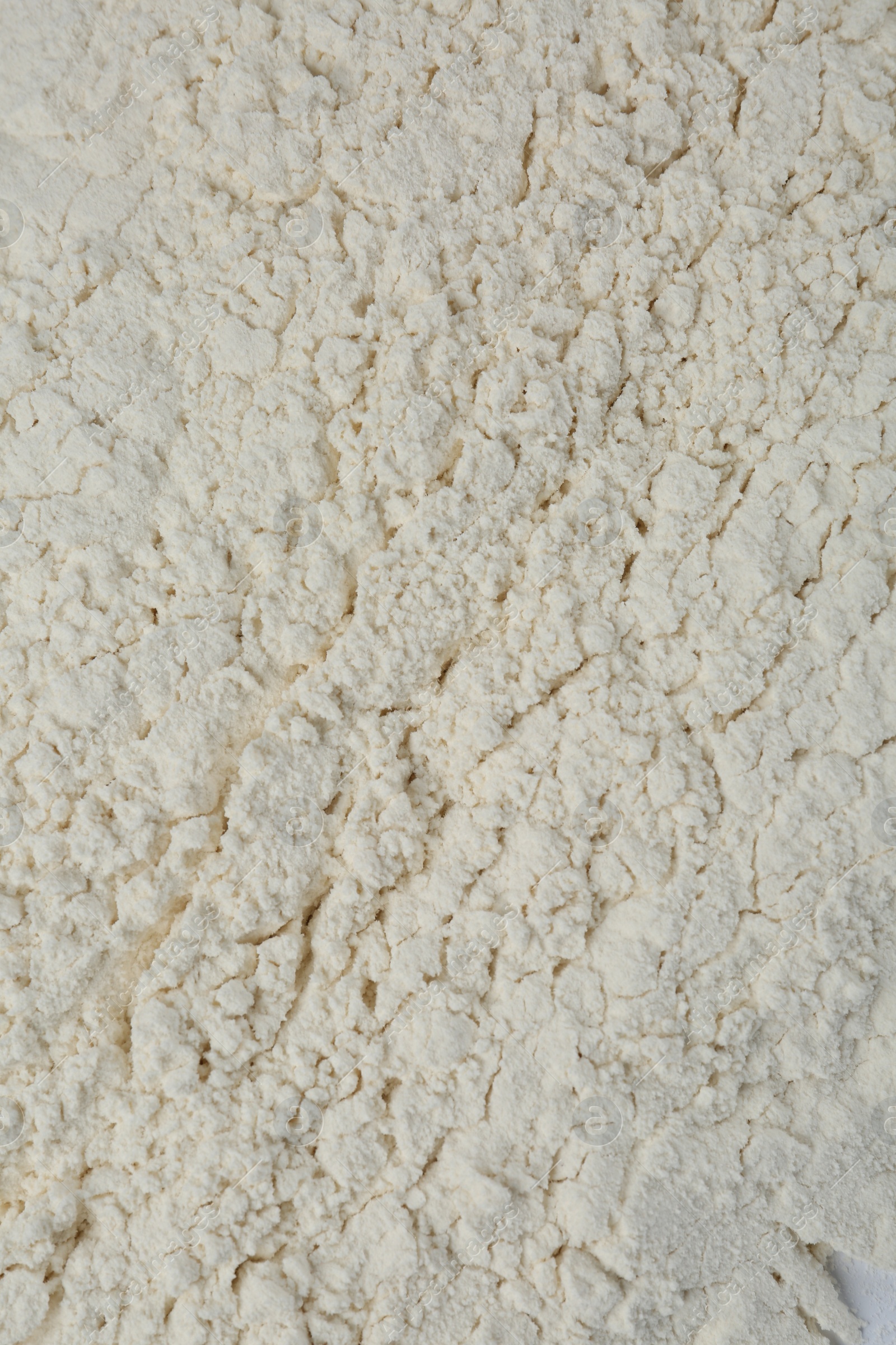 Photo of Pile of organic flour as background, top view