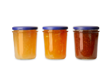 Photo of Jars of different delicious jams on white background