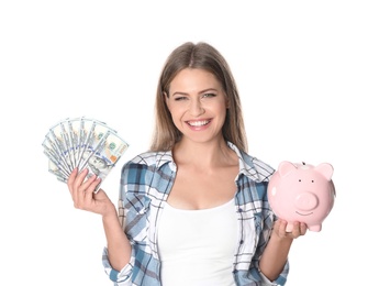 Photo of Portrait of happy young woman with money and piggy bank on white background