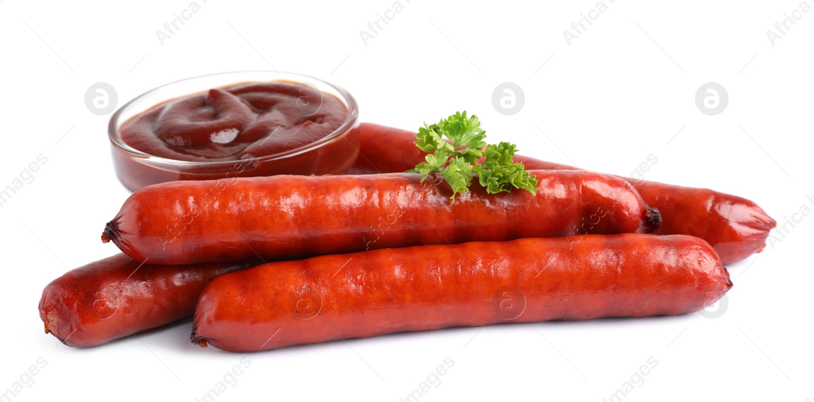 Photo of Delicious grilled sausages and sauce on white background. Barbecue food