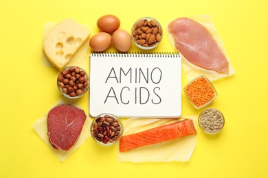 Flat lay composition with products rich in amino acids on yellow background