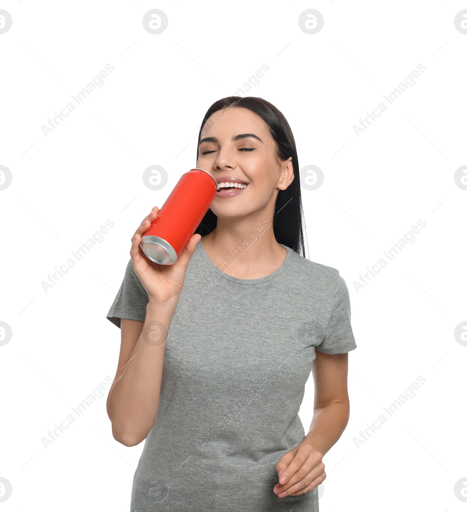 Photo of Beautiful happy woman drinking from red beverage can on white background