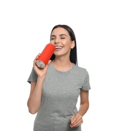 Photo of Beautiful happy woman drinking from red beverage can on white background