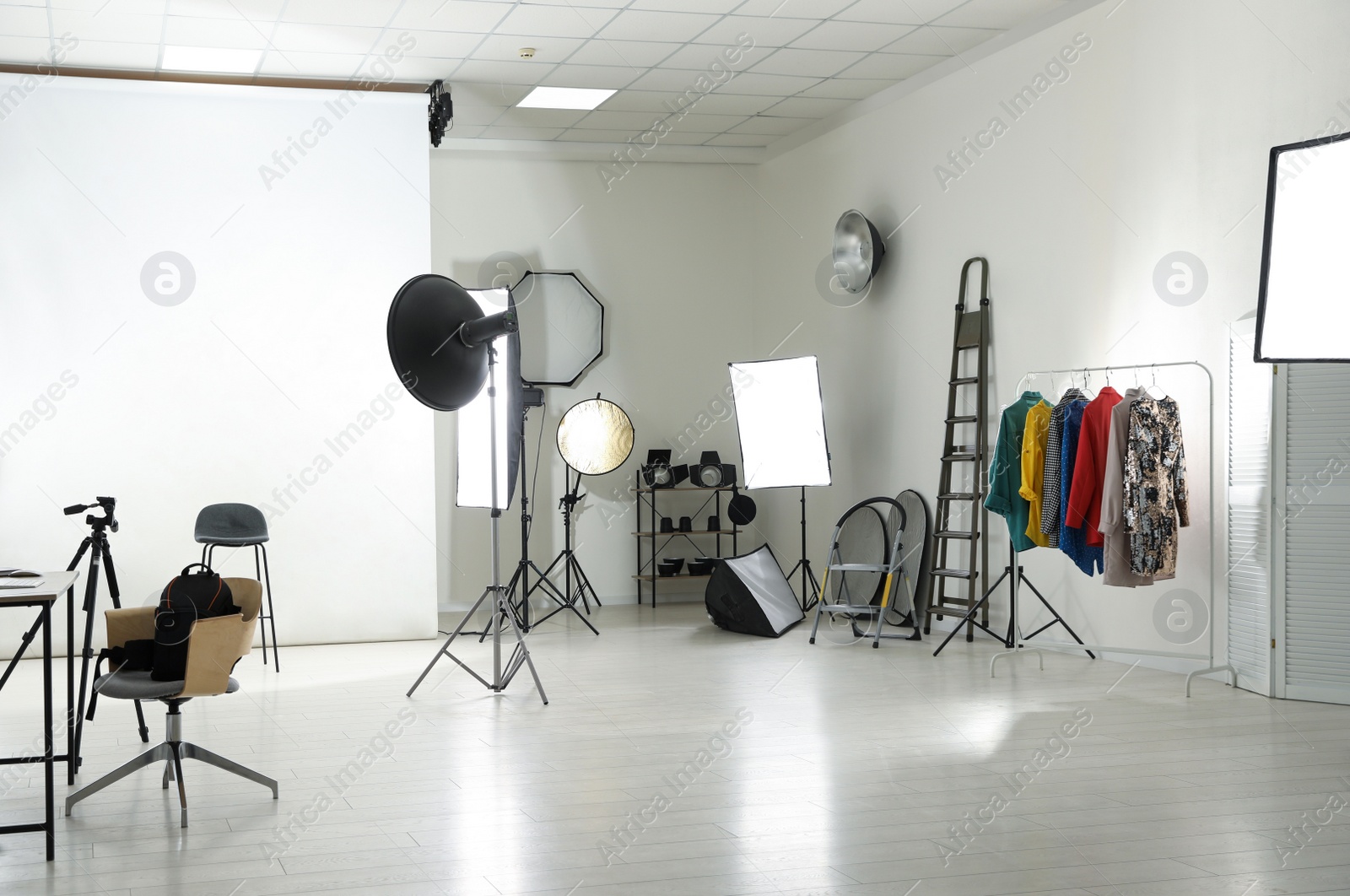 Photo of Interior of modern photo studio with professional equipment