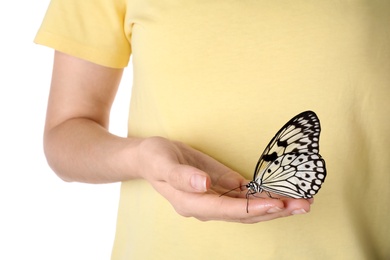 Photo of Woman holding beautiful rice paper butterfly on white background, closeup